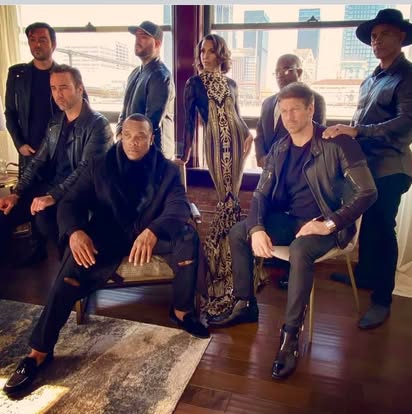 Ensemble cast and production team portrait