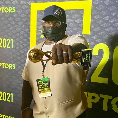 Marcelle Baber holding a 2021 festival award